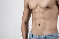 Lying leg raises builds stronger abs. (Image via Freepik)